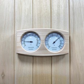 Wooden sauna hygrometer with temperature and humidity readings.